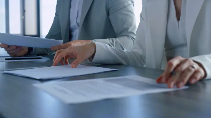 people looking at documents